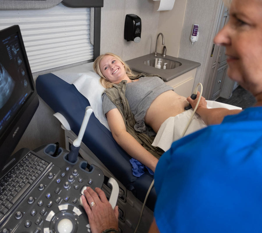 A woman receiving an ultrasound at ICU Mobile